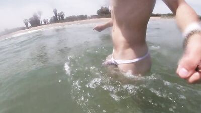 I have a sexy cock and I think people must know so I wear a see through thong in a public beach