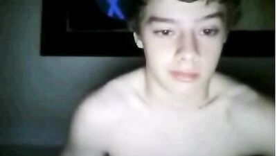 Handsome smooth boy masturbates in the dark