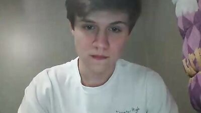 Attractive young boy masturbating on her bed