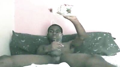 Straight black boy servicing his big dick at home