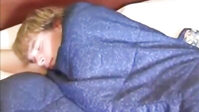 Dad wanks his son in the bed