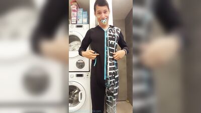 Happy diaper boy putting on his sleeper