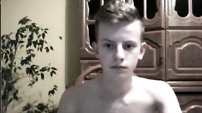 An angel masturbates in the living room of his parents