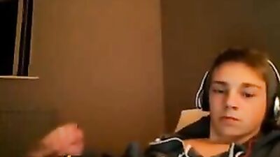 All dressed he masturbates on his bed