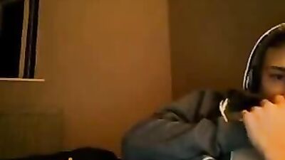 All dressed he masturbates on his bed