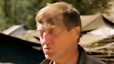 Military are taking a shower outdoors