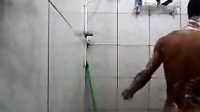 Boy takes a shower and washes well