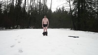 Strips and remains naked in the snow