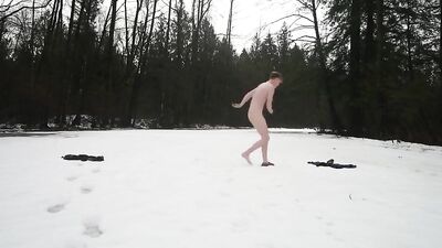 Strips and remains naked in the snow