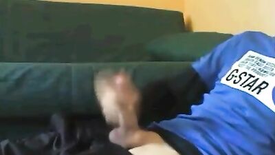 Smooth young he masturbates on the floor of the living room