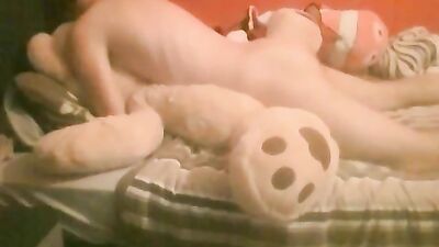 Boy plays with teddy stuffed animals