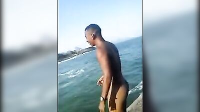 Beautiful Brazilian boy plunges from the cliff