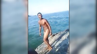 Beautiful Brazilian boy plunges from the cliff