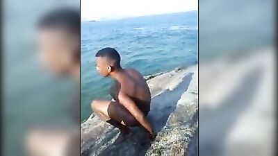 Beautiful Brazilian boy plunges from the cliff