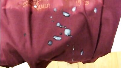 Jerking off and cumming in a dressing room with a guy behind