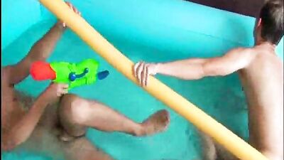Gay Twinks Splashing Fun in the Paddling Pool - A Playful Adventure!