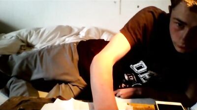 A handsome smooth boy masturbates with both hands