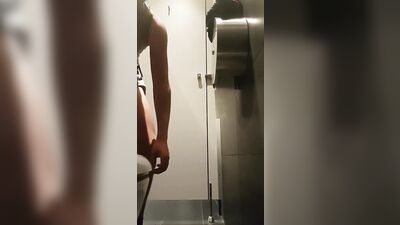 Wanking in public toilet