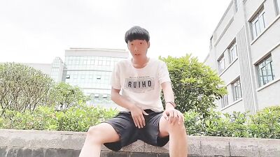 Young Asian Boy Takes Cock in Public and Comes on Hand