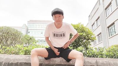 Young Asian Boy Takes Cock in Public and Comes on Hand