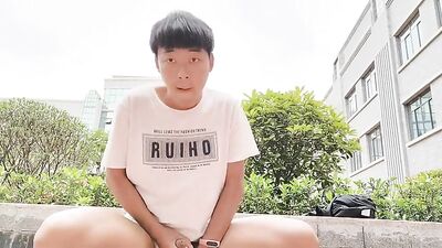 Young Asian Boy Takes Cock in Public and Comes on Hand