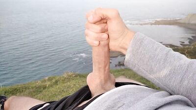 Huge Dirty Cock Gets Handjob In Public And Squirts A Lot Of Thick Sperm In Front Of The Beach