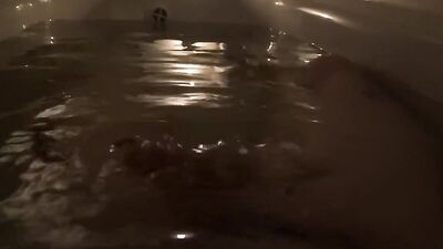 Young guy takes a bath with candles and cum there