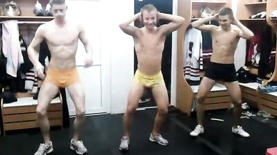 Three straight guys dance in the locker room