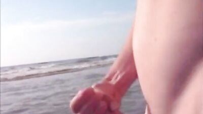 Twink jerking and cumming in the sea