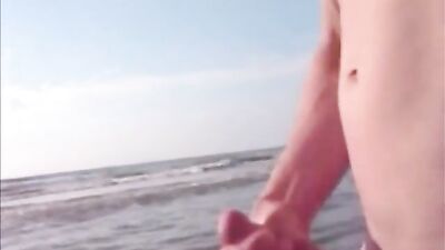 Twink jerking and cumming in the sea