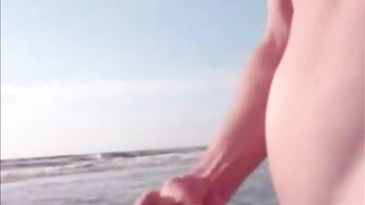 Twink jerking and cumming in the sea