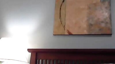 A boy plays on his bed