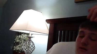 A boy plays on his bed