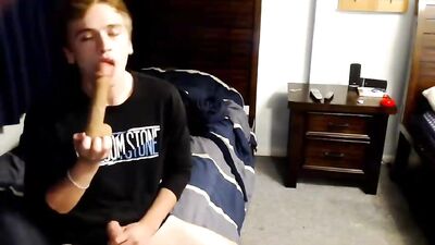 Hot boy masturbates while sucking dildo