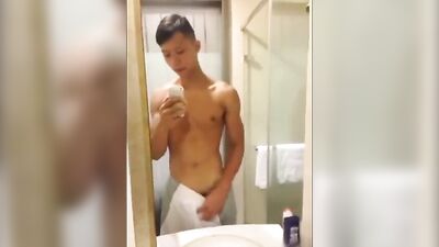 Chinese hung jerks off in bathroom