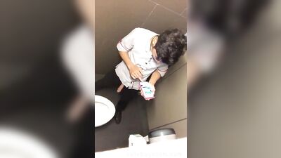 Geezer wanking in the toilets