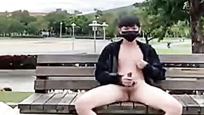 Outdoor Pleasures: Asian Amateur Jerks Off in Public!