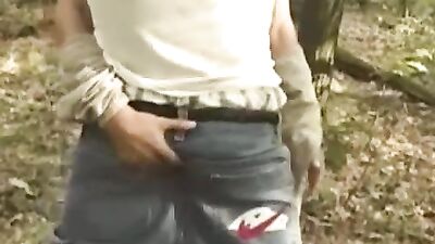 Boy in forrest and car