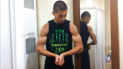 Muscle God Rising: Shredded Teen Flexes in Torn Shirt!