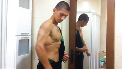 Muscle God Rising: Shredded Teen Flexes in Torn Shirt!