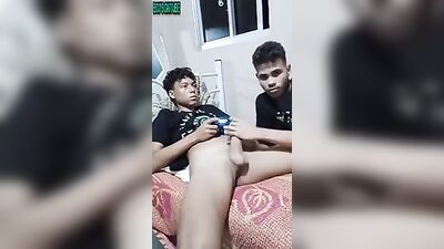 Latino Passion: Friendly Latino Boy Plays Game while Sucking and Jacking Off his Pal!