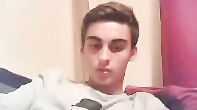 Young stud unloads while watching hot gay porn!