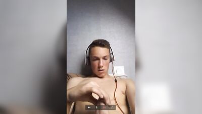Young Blonde Boy Cums Hard With Headphones On: A Web-Cam Handjob Experience!