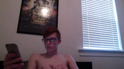 Nerdy Star Wars twink checks out some gay porn on his phone