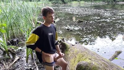 Jerking off in public park pond! - A hot and naughty twink in action!