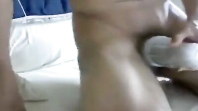 Latino boys porn pulls his thick uncut cock with his toy