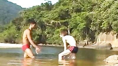 Gay Porn Videos: Dark-Skinned Buddy Fucks Skinny Twink by the River!