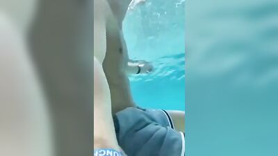 Gay Porn: Latin Stud Jerks in Pool Heat