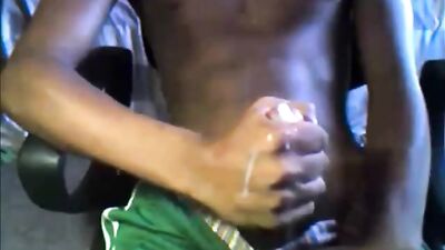 Hung black boy in green shorts with massive cumshot: A wild solo web-cam experience!