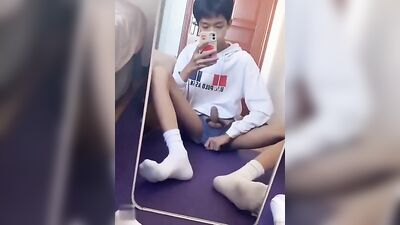 Young Asian Solo Show in Front of Mirror